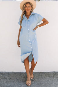 Chambray Midi Dress - the ideal mix of comfort and style. Full-length view of the Chambray Button-Up Midi Dress. Front view of Chambray Midi Dress with button closure. Woman's casual outfit featuring Chambray Button-Up Midi Dress. Close-up of tacked rolled sleeves on Chambray Midi Dress. Woman flaunting her Chambray Button-Up Midi Dress at work. Lightweight Chambray Midi Dress - a wardrobe essential. Chambray Midi Dress styled with a comfy bralette.