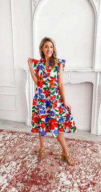 Women's fashion- Midi dress- Floral print- Elegance- Tiered body- Playful flair- Dress design- Fashion trend- Stylish dress- Day dress- Feminine style- Bold print- Dress detail- Unique design- Dress silhouette- Floral pattern- Comfortable dress- Flowing dress- Lightweight fabric