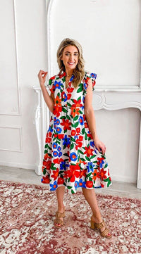 Women's fashion- Midi dress- Floral print- Vibrant colors- Spring fashion- Summer style- Floral fusion- Bold print- Dress design- Fashion trend- Beautiful dress- Day dress- Colorful dress- Fashion statement- Versatile fashion Flowing dress- Casual wear- Beachwear