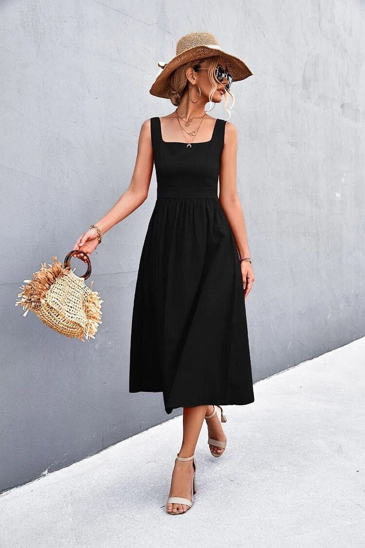 A woman wearing a Sleeveless Square-Neck Midi Dress, exuding elegance and comfort.