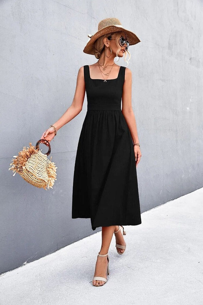 A woman wearing a Sleeveless Square-Neck Midi Dress, exuding elegance and comfort.