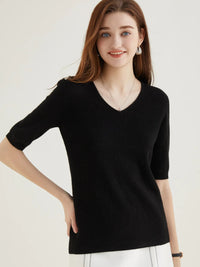 A woman wearing an Elegant V-Neck Knit Half Sleeve Sweater.