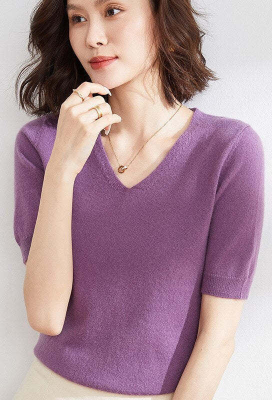 A woman wearing an Elegant V-Neck Knit Half Sleeve Sweater.