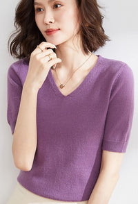 A woman wearing an Elegant V-Neck Knit Half Sleeve Sweater.
