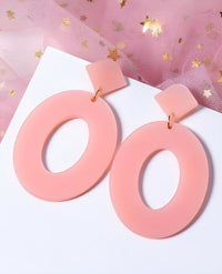 Double the cuteness! Two brilliant transparent pink resin drop earrings made in a gorgeously retro cutout teardrop shape and attached to a traditional stud. Only while supplies last.