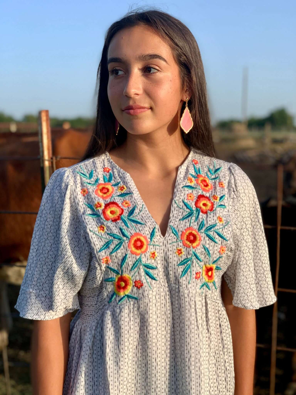 What a stunning blouse with just the ideal amount of embroidery. The floral is incredibly vibrant, and the blouse is so light and breezy! This blouse is not at all tight, it is very forgiving, and it flows beautifully!