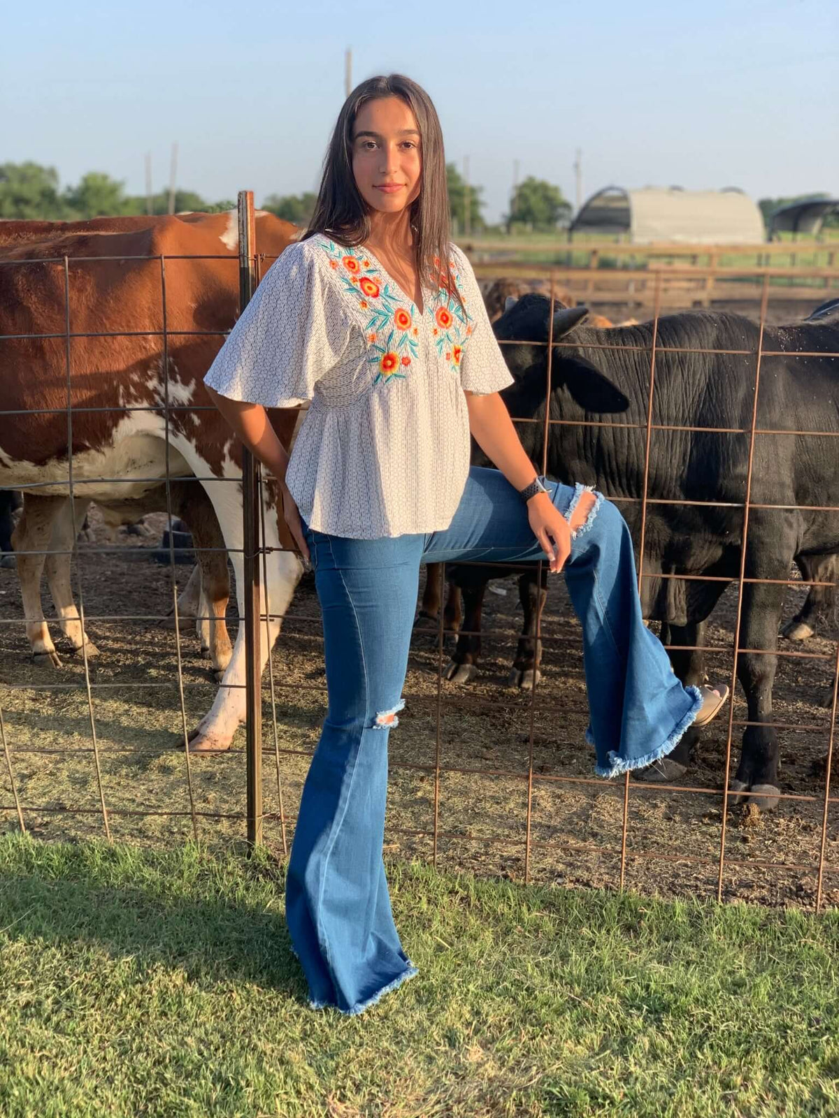 Lightweight The shirt print is in light ivory and a blue-grey color. 100% Rayon Embroidered printed top