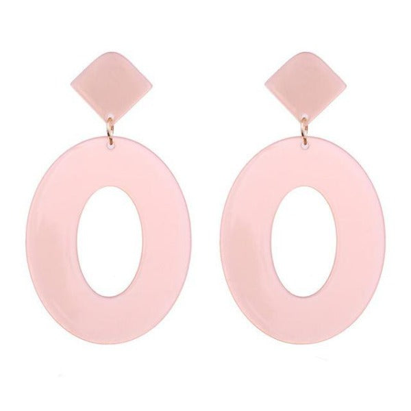 Double the cuteness! Two brilliant transparent pink resin drop earrings made in a gorgeously retro cutout teardrop shape and attached to a traditional stud. Only while supplies last.