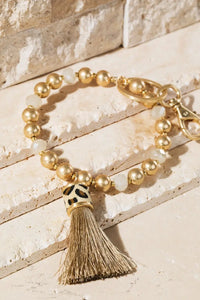 Shimmer and Gold Tassel Key Ring Bracelet Jolie Vaughan | Online Clothing Boutique near Baton Rouge, LA