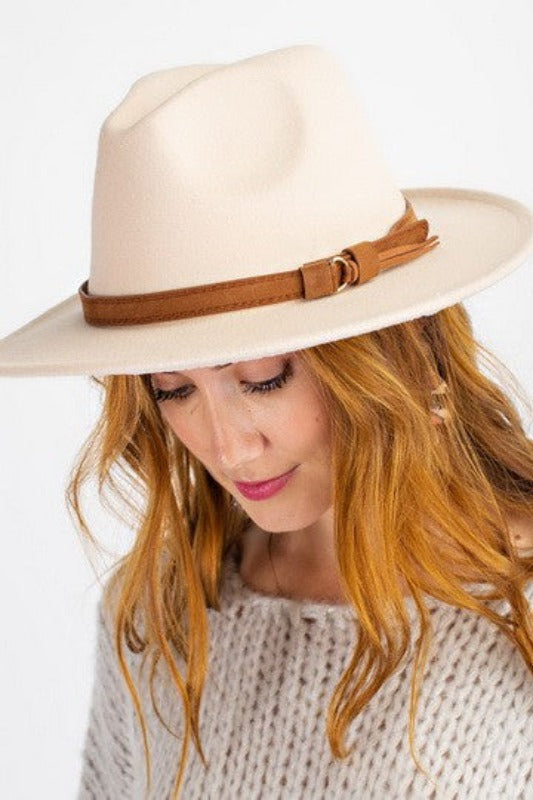 Wide Brim Fashion Hat with Buckle Detail - Jolie Vaughan | Online Clothing Boutique near Baton Rouge, LA The Wide Brim Fedora with buckles detail is a fashionable, wide brimmed hat that will keep you looking classy. You can wear this in any season and it goes well with a dress or pants. The fedora is made of wool felt which provides good protection from the sun while still keeping your head cool.