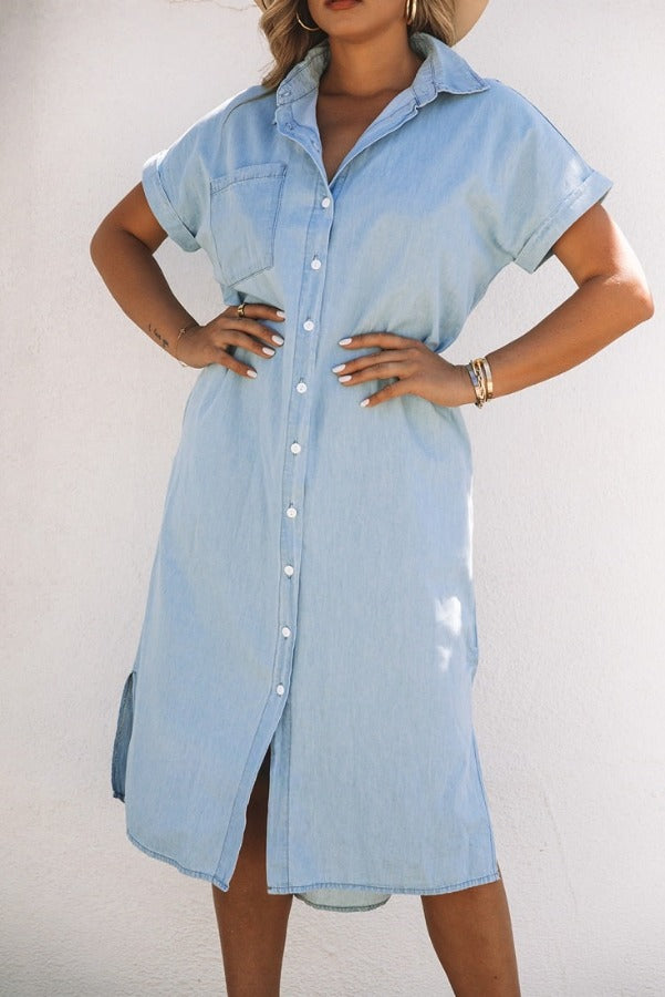 Woman looking stylish in her Chambray Button-Up Midi Dress. Trendy Chambray Midi Dress available in various designs. Casual and chic Chambray Button-Up Midi Dress. Chambray Midi Dress, perfect for school or holiday. Woman showing off the side slits of Chambray Midi Dress. Top-down view of Chambray Button-Up Midi Dress. Woman wearing Chambray Midi Dress on a casual day out.