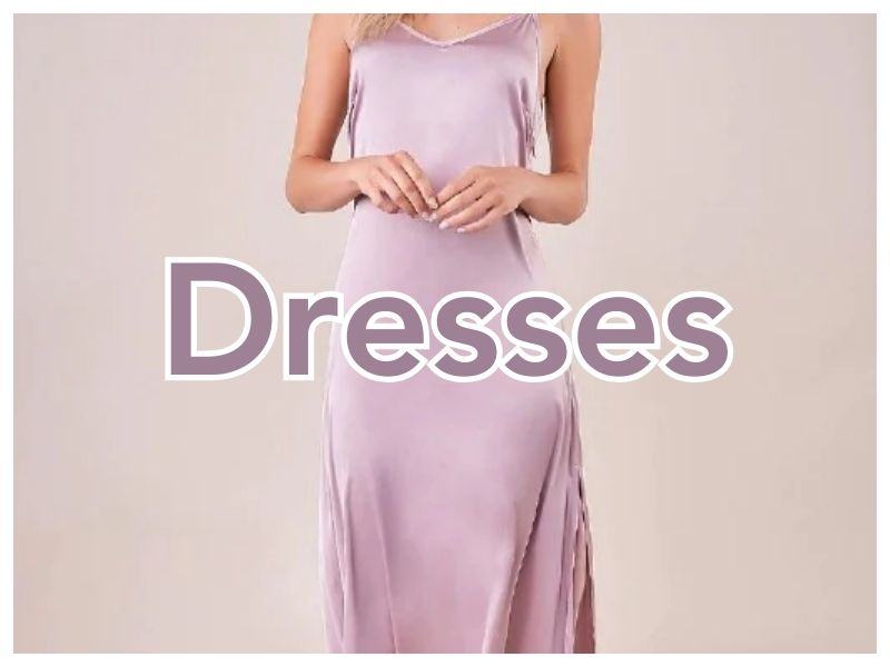 Shop Women's Dresses | Jolie Vaughan Boutique [Image Description - a woman wearing a lavender colored silk slip dress with the text "Dresses" written over top.]