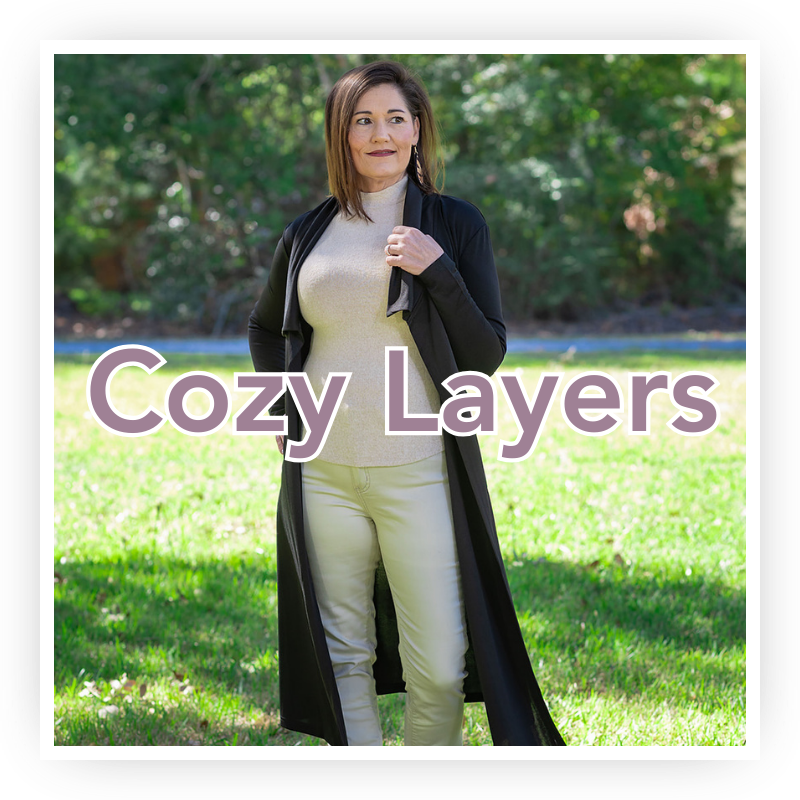 Shop Women's Layering Pieces - Jackets, Sweaters, Long Sleeves | Jolie Vaughan Boutique [Image Description - a gorgeous, 40-something year old woman wearing an oatmeal colored turtleneck sweater and khaki pants with a long black open front cardigan with the text "Cozy Layers" written over top.]