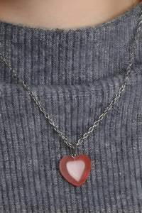 Blissful Stone Heart Necklace featuring delicate heart-shaped pendants on an adjustable stainless-steel chain. Elevate any outfit with this unique and versatile accessory.