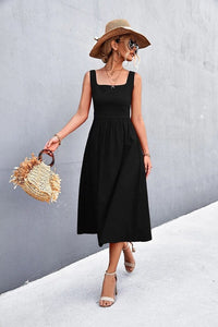 A woman wearing a Sleeveless Square-Neck Midi Dress, exuding elegance and comfort.