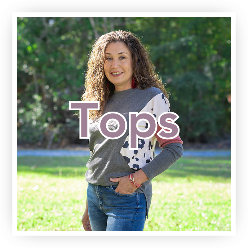 Shop Women's Tops | Jolie Vaughan Boutique [Image Description - a beautiful, 40-something year old woman wearing a grey, white, and maroon dolman sweater with a little pop of leopard print with the text "Tops" written over top.]