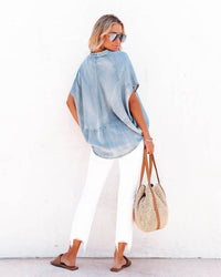 Elevated casual wear- Fashionable and functional- Timeless chambray style- Effortless day-to-night transition- Relaxed and laid-back vibe- Easy-breezy summer essential- Stylish and practical- Effortless fashion choice-Women's oversized chambray shirt Split neckline Short sleeves Soft and breathable Cotton fabric Relaxed fit Casual style Denim-like appearance Lightweight Comfortable Versatile Easy to wear Effortless chic Breathable fabric Relaxed silhouette Everyday essential Wardrobe staple