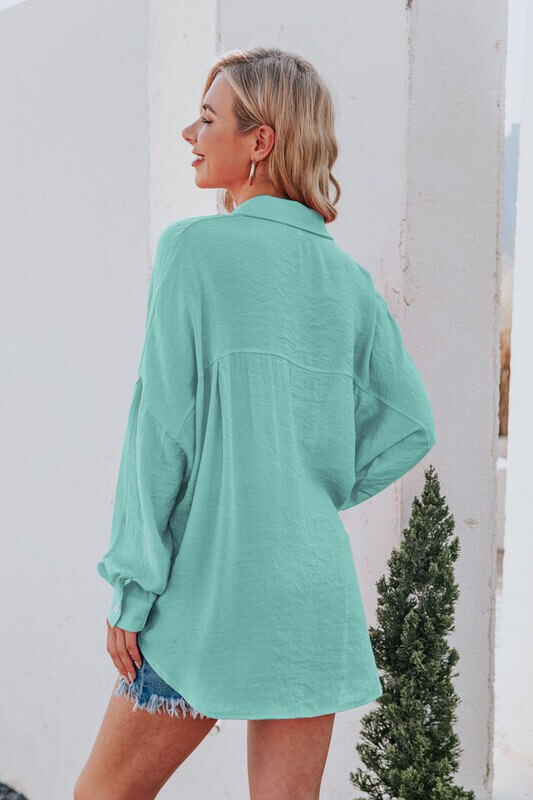 constructed of lightweight gauze fabric, making it ideal for summer, and it boasts front breast pockets for added convenience.