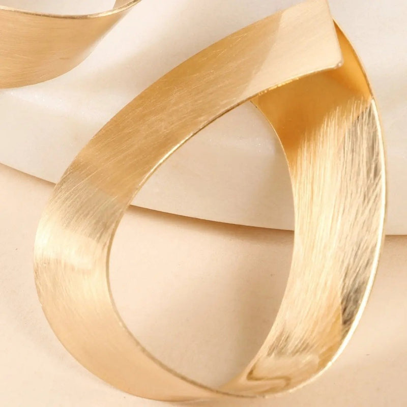 Brushed Metal Infinity Ribbon Earrings Jolie Vaughan | Online Clothing Boutique near Baton Rouge, LA